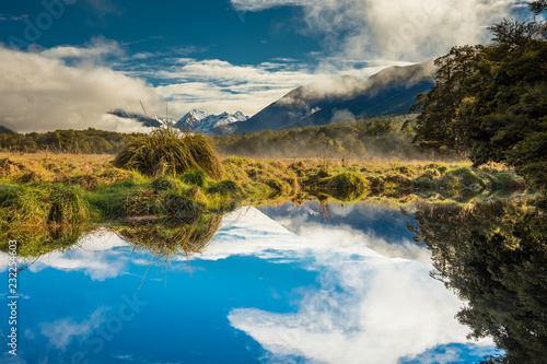 Fototapeta Naklejka Na Ścianę i Meble -  Mirror Lakes with reflection of Earl Mountains, Fjordland National Park, Millford, New Zealand