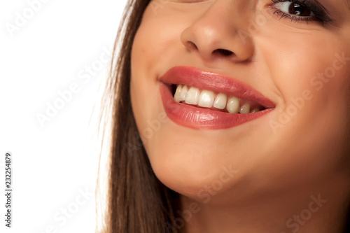 Smiling woman with natural and healthy teeth