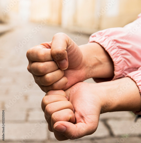 The hands compressed in a fist © julijacernjaka