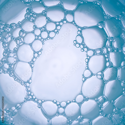 Macro close up of bubbles in glass of water. Scientific, cell membrane