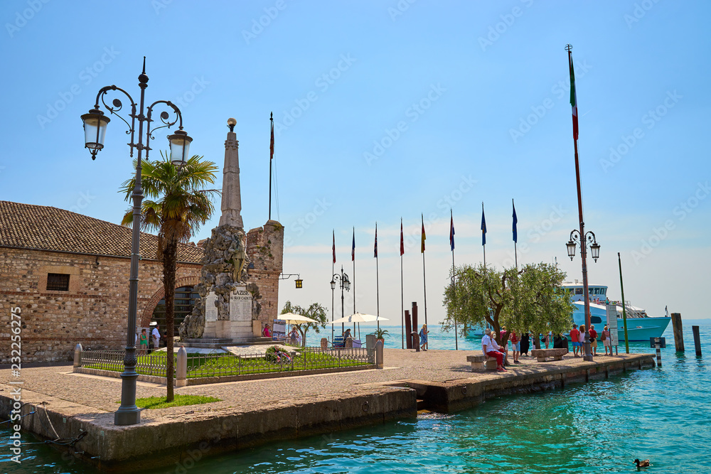 Harbor in city of Lazise with boats / Lake Garda in Italy