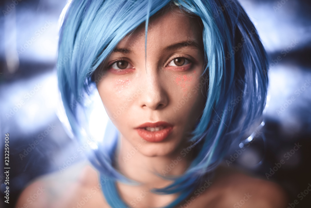 Girl with blue hair with smoke in the photo Girl with blue hair with smoke in the photo