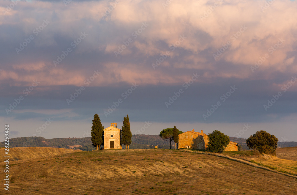 TALY, TUSCANY - SEPTEMBER 23, 2017: The Chapel Of Our Lady Of Vitaleta at sunset