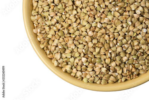 Natural fresh green buckwheat in ceramic bowl on white background.