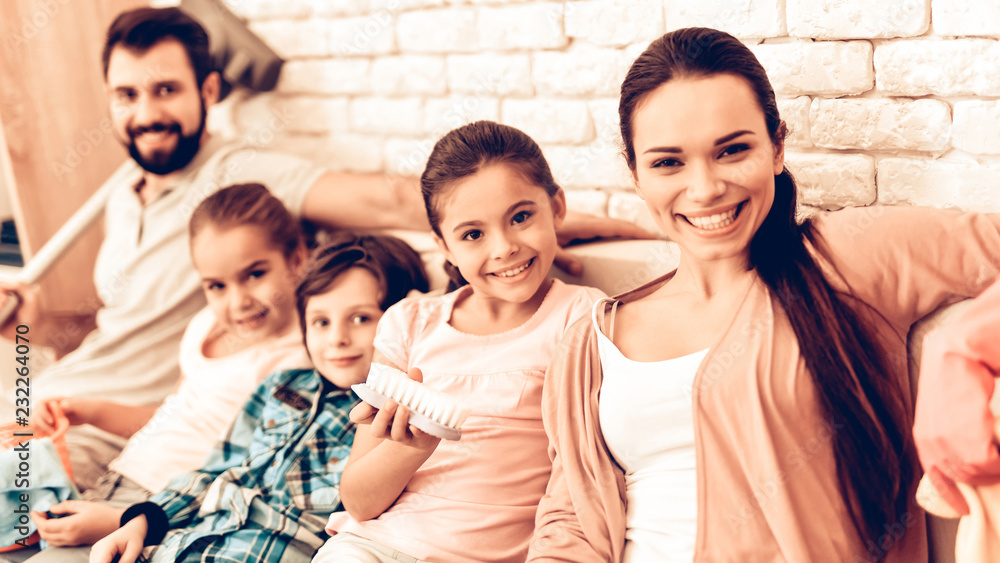 Portrait of Pleased Family After Cleaning Home. Portrait of Pleased Family After Cleaning Home.