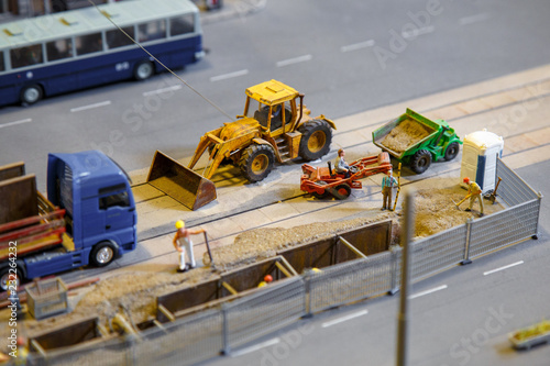 View of construction site of mini toy workers and vehicle