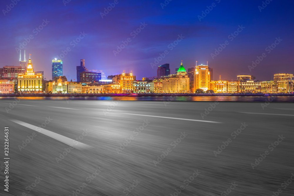 Empty asphalt road along modern commercial buildings in China's cities