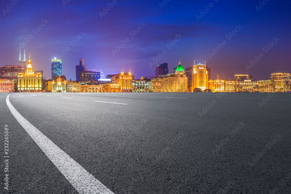 Empty asphalt road along modern commercial buildings in China's cities Empty asphalt road along modern commercial buildings in China's cities