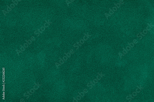 Dark green matt suede fabric closeup. Velvet texture. photo