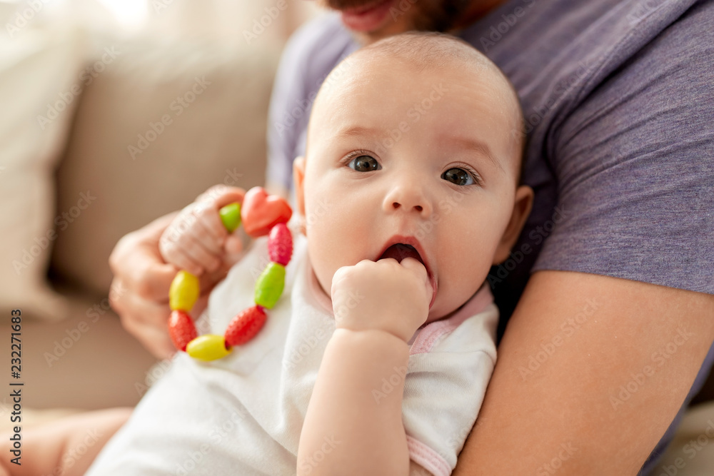 family, parenthood and people concept - close up of father with little baby girl at home family, parenthood and people concept - close up of father with little baby girl at home