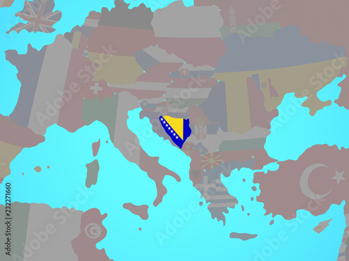 Bosnia and Herzegovina with national flag on blue political globe. photo