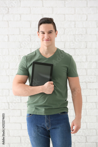 Young man with tablet compu...