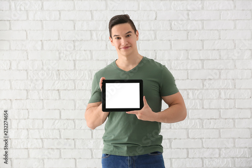 Young man with tablet compu...