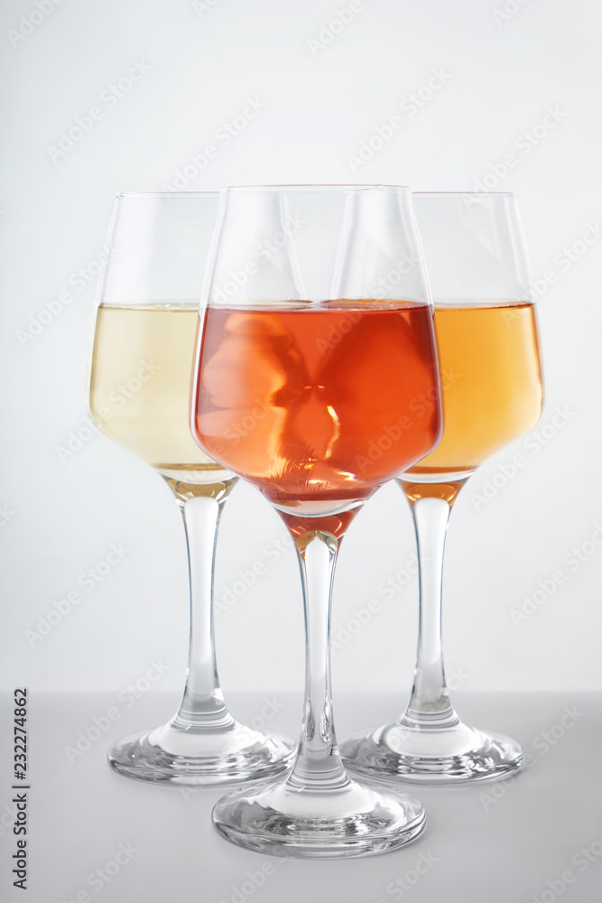 Glasses of tasty wine on white background Glasses of tasty wine on white background