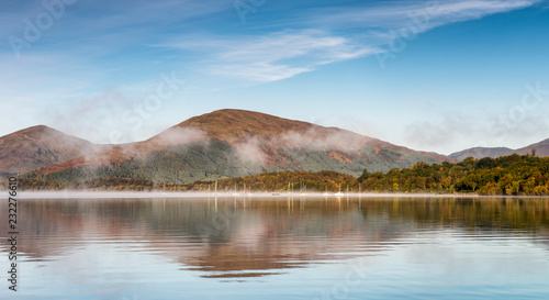 A misty dawn over Loch Lomond from Milarrochy Bay