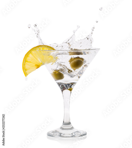 Martini splash with olives in a transparent glass