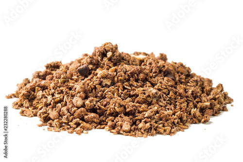 Crunchy granola, muesli pile with chocolate isolated on white background