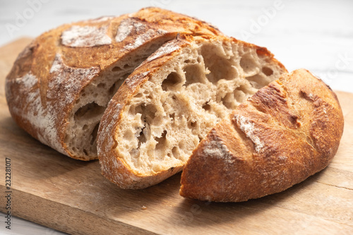 sliced bread on a wooden board close-up, homemade product