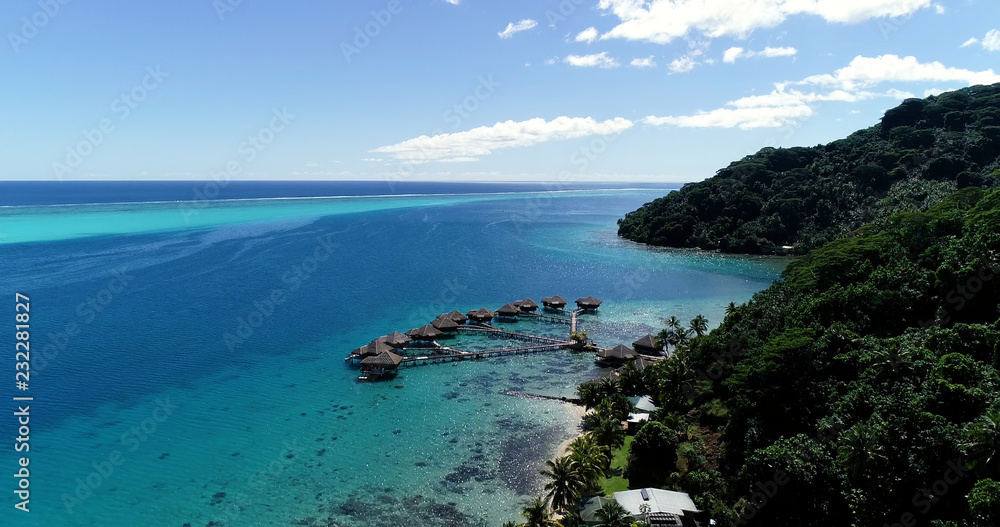 Fototapeta premium bungalow on the water in aerial view, french polynesia