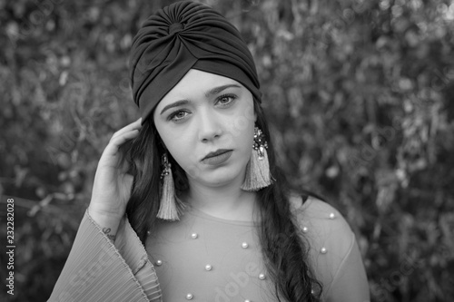 Portrait of young woman with cap on her head. photo