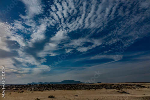 Beautiful sky over the dunes in the Natural park of Corralejo,Fuerteventura,Las Palmas,Canary islands,Spain.