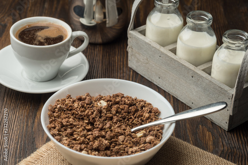 Healthy breakfast fresh cereal  milk bottle  coffee cup.