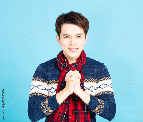 Young Asian man with gesture of congratulation