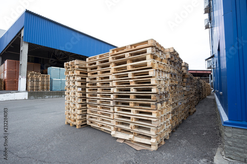 Row of wooden pallets in stock