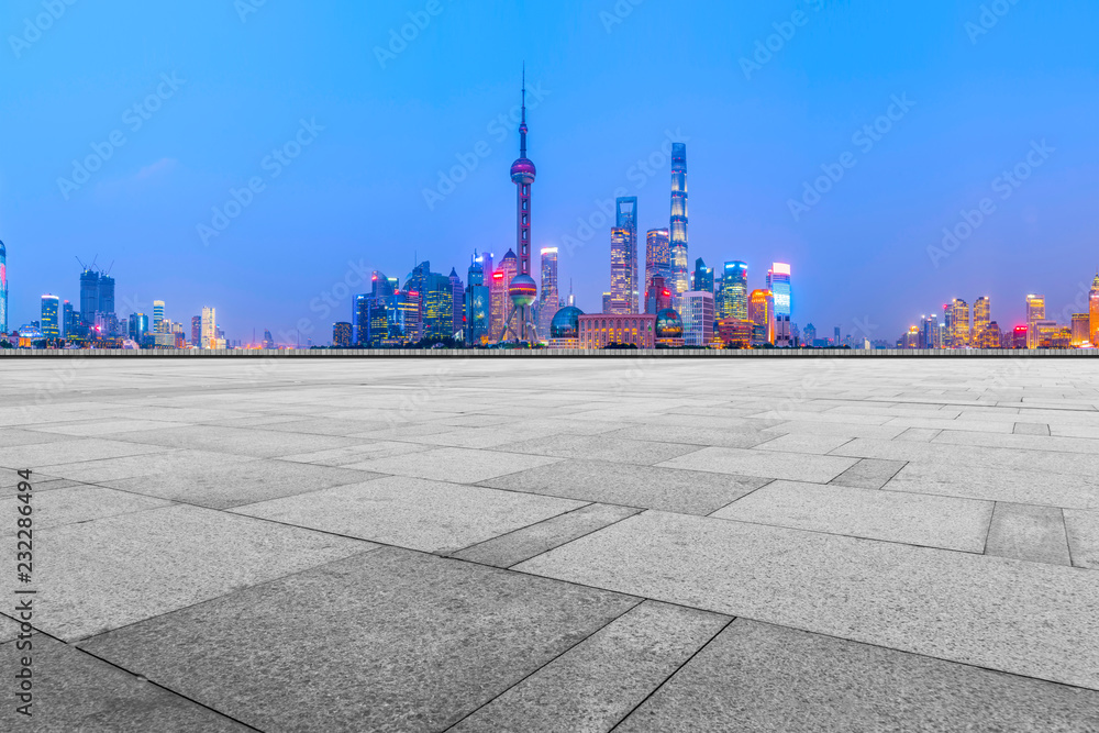 Blue sky, empty marble floor and skyline of Shanghai urban architecture.