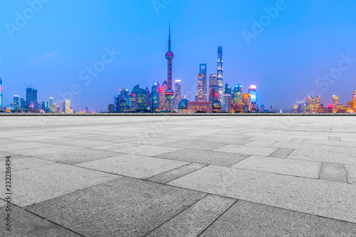 Blue sky, empty marble floor and skyline of Shanghai urban architecture.