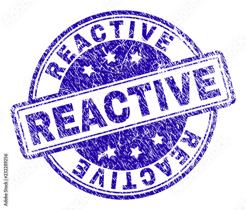 REACTIVE stamp seal watermark with distress texture. Designed with rounded rectangles and circles. Blue vector rubber print of REACTIVE tag with dust texture.