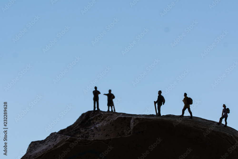 group of people on top of mountain