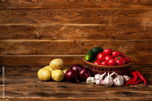 Vegetables on a brown wooden background