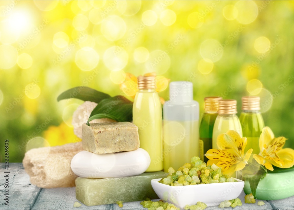 Bottles with organic essential aroma oils on background Bottles with organic essential aroma oils on background