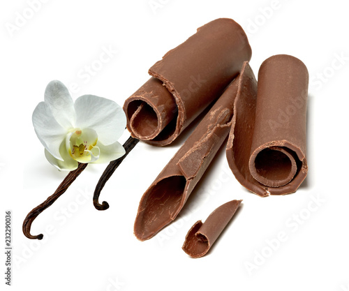 Dark chocolate curls and vanilla beans isolated on white background