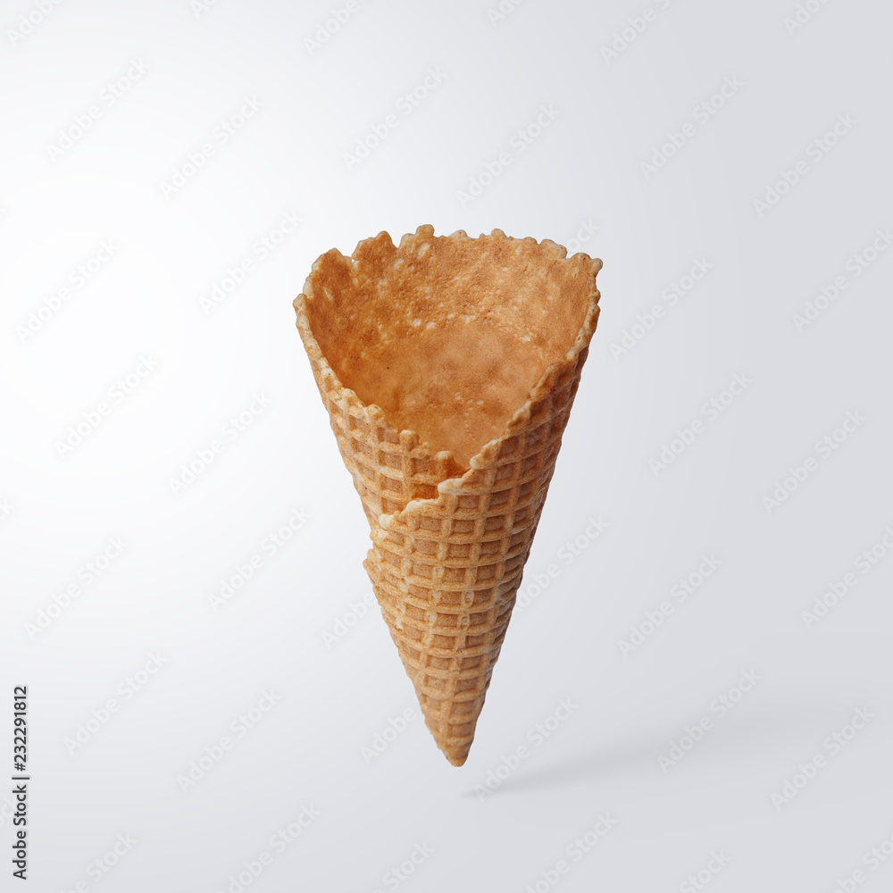 Wafer ice cream cone on a light gray background. Minimalistic concept. Wafer ice cream cone on a light gray background. Minimalistic concept.