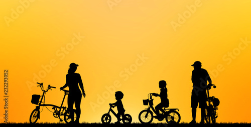 silhouette family  riding bicycle on blurry sunset