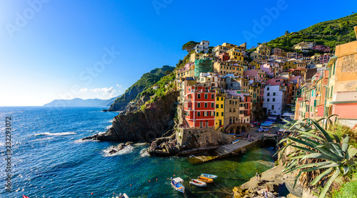 Riomaggiore - Village of Cinque Terre National Park at Coast of Italy. Beautiful colors at sunset. Province of La Spezia, Liguria, in the north of Italy - Travel destination and attractions in Europe.