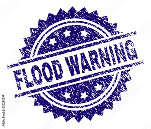 FLOOD WARNING stamp seal watermark with distress style. Blue vector rubber print of FLOOD WARNING text with grunge texture.
