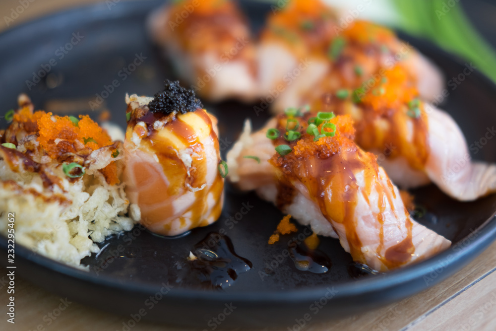 Sushi roll with salmon, selective focus. Sushi roll with salmon, selective focus.