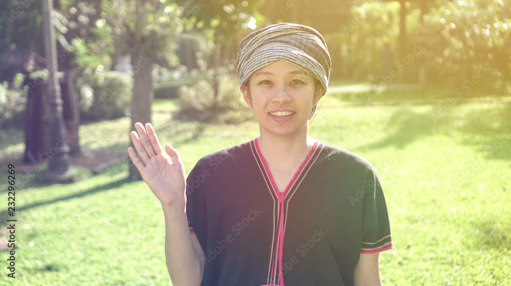 Asian ethnic woman with native dress smile at her organic rice field Asian ethnic woman with native dress smile at her organic rice field