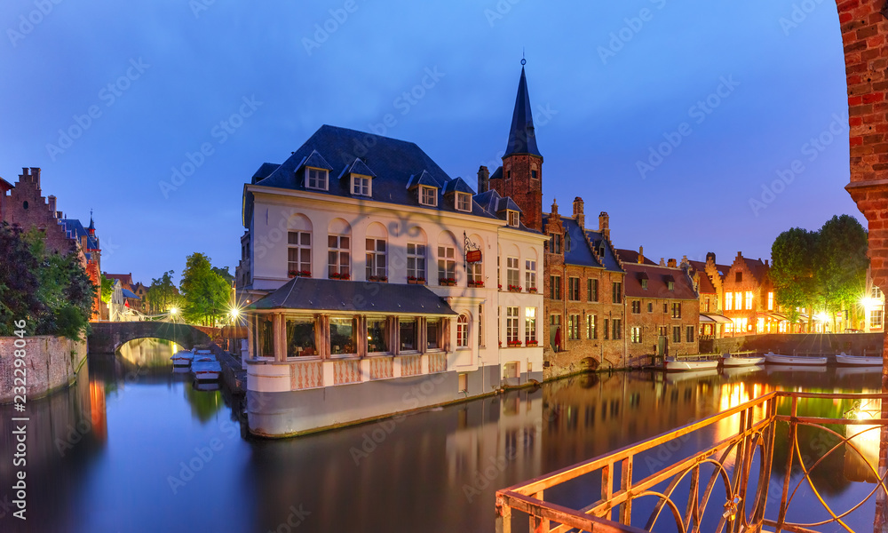 Scenic cityscape with a medieval fairytale town at night in Bruges, Belgium