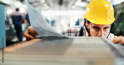 Photos Supervisor doing quality control and pruduction check in factory