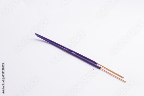 Purple Incence sticks isolated on white background