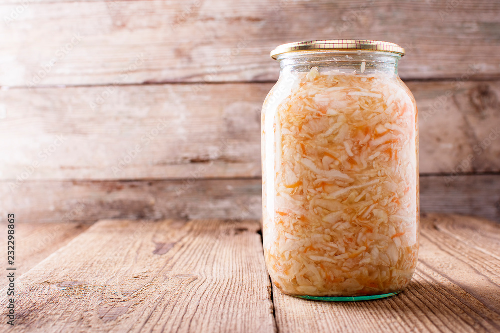 sauerkraut in a jar, on a wooden table, side view, Copyspace sauerkraut in a jar, on a wooden table, side view, Copyspace