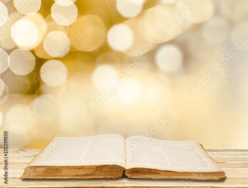 Open Holy bible book on background