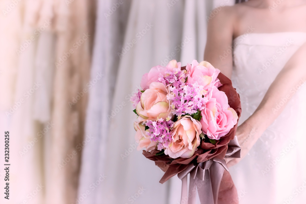 Bride holding beautiful pink wedding flowers bouquet Bride holding beautiful pink wedding flowers bouquet