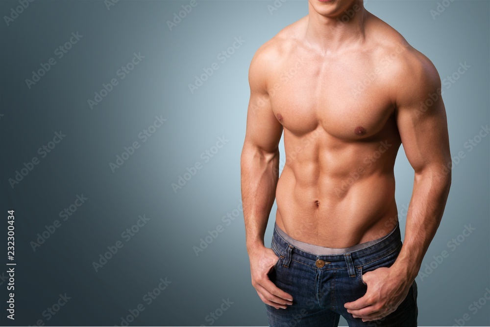 Cropped image of fit muscular body of sportsman Cropped image of fit muscular body of sportsman