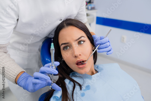 Terrified patient at dentist office.