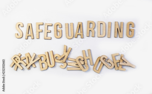 Safeguarding concept, word spelled out in wooden letters photo